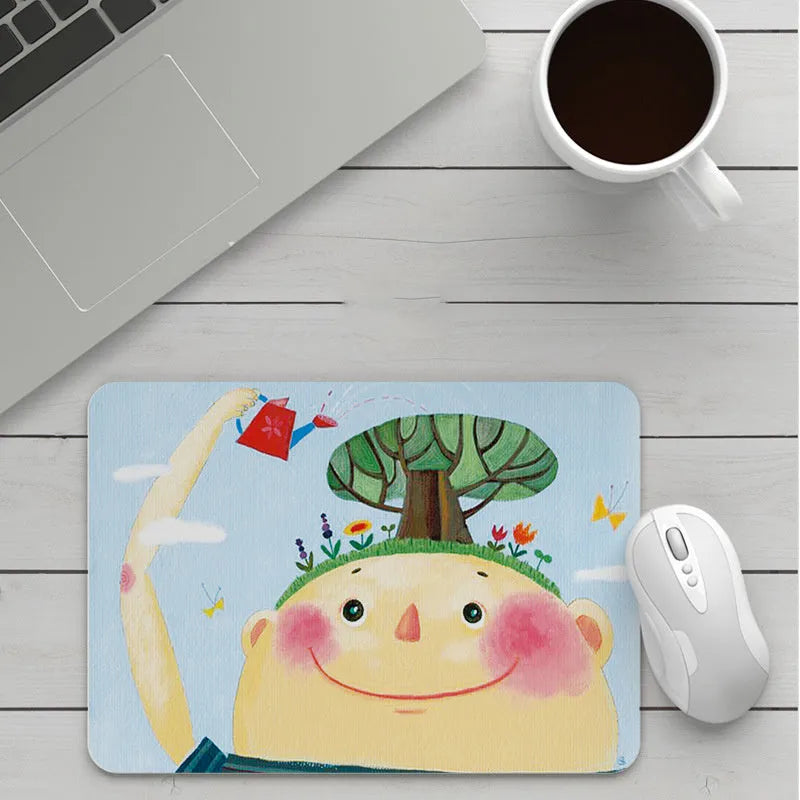 Custom cartoon design mouse pad with non-slip rubber base, showing sample patterns including strawberry and cartoon cat.