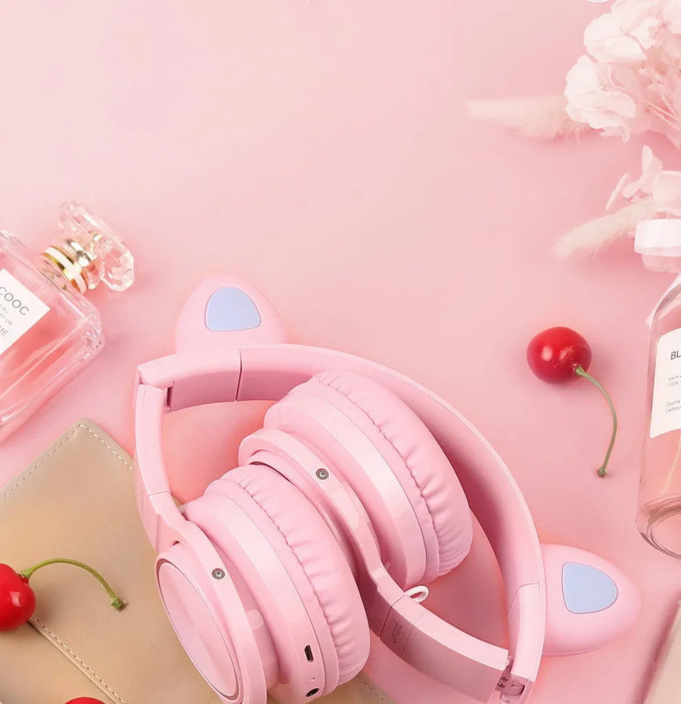 Pink and white luminous Bluetooth headset with LED lighting and over-ear design