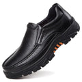 Men's black and brown cowhide leather slip-on business casual shoes with rubber sole.