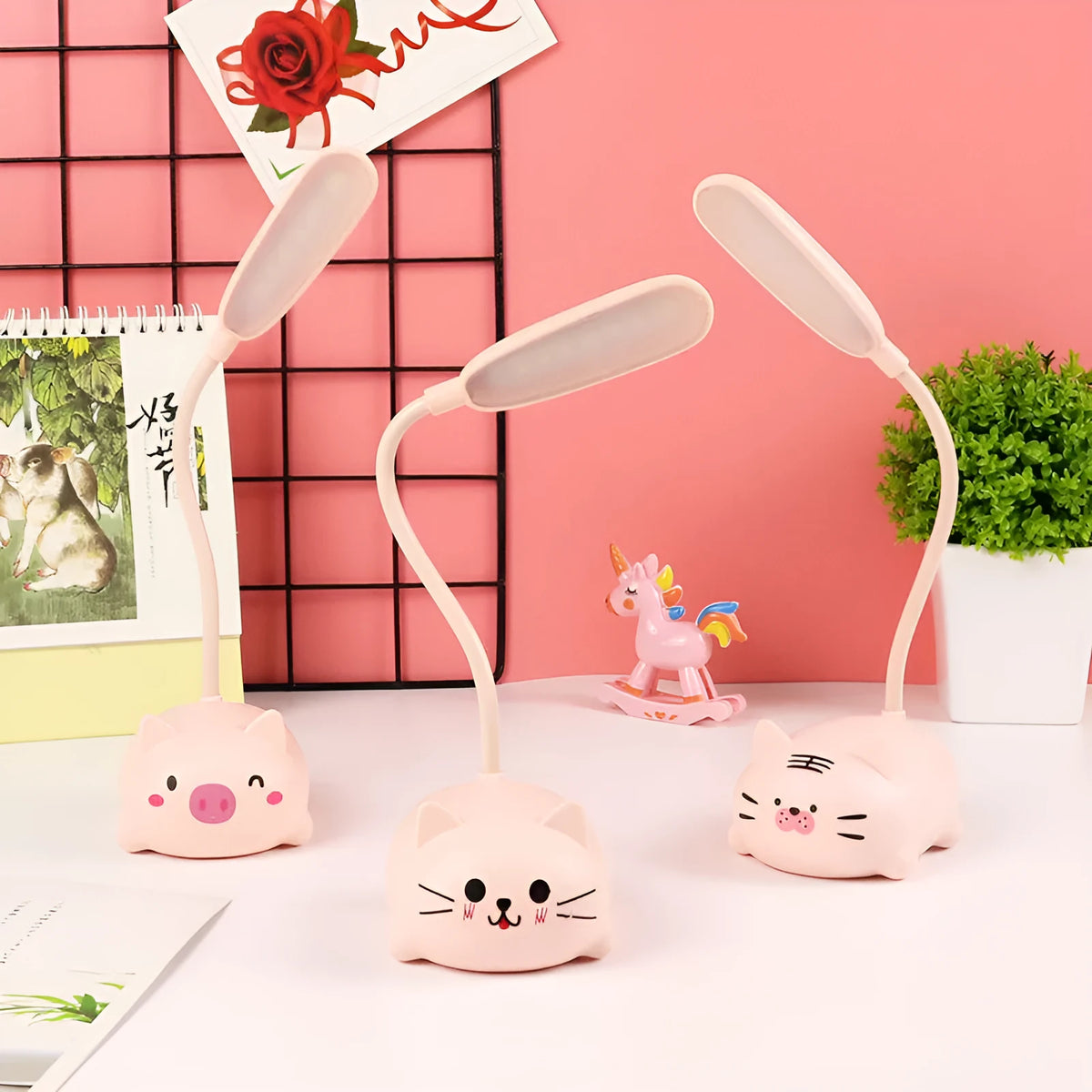 USB rechargeable LED book light in warm white, available in blue or pink with animal designs