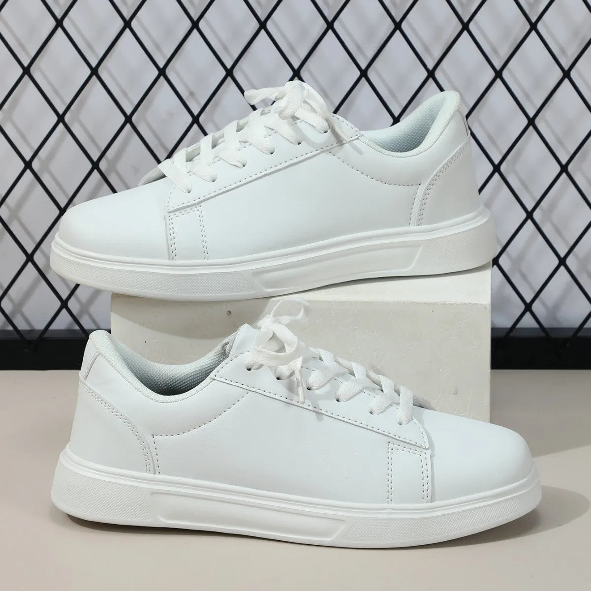 Beige brown platform casual skateboard sneaker with round toe and cross-strap detail on a white background.
