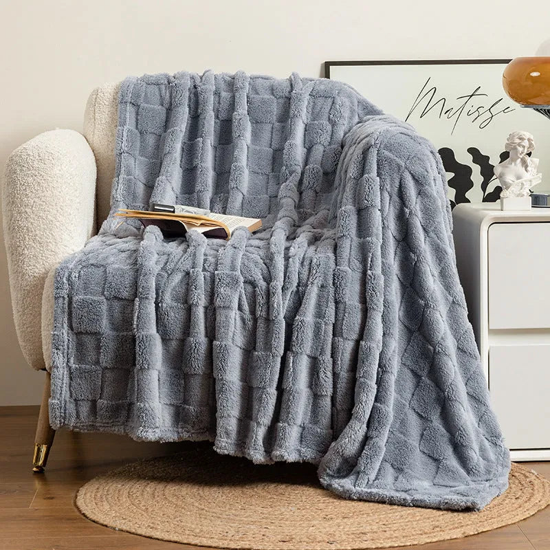 Geometric pattern polyester sofa blanket in dark grey, laid out to show size.