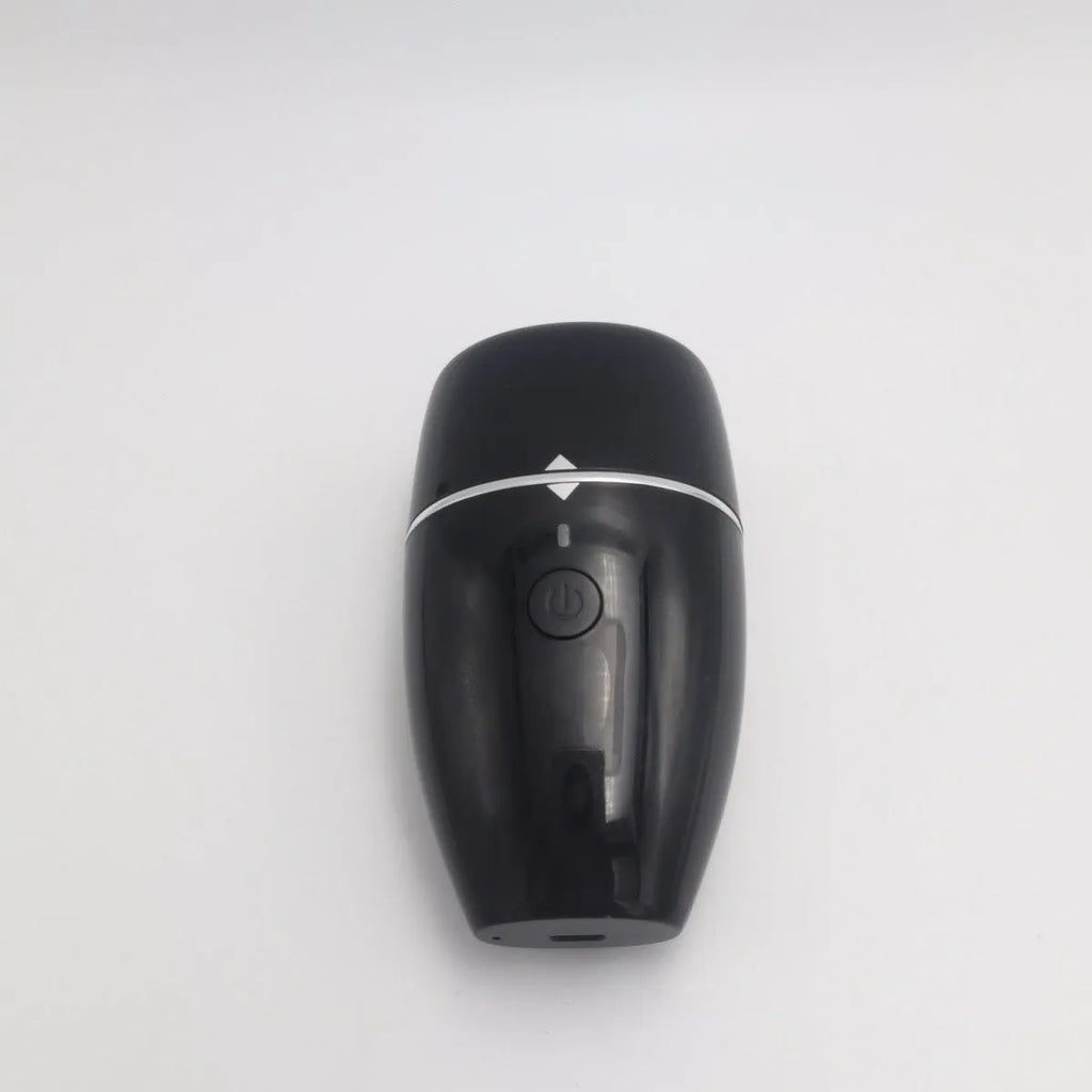 Black and white electric silicone lip plumper device with USB charging cable.