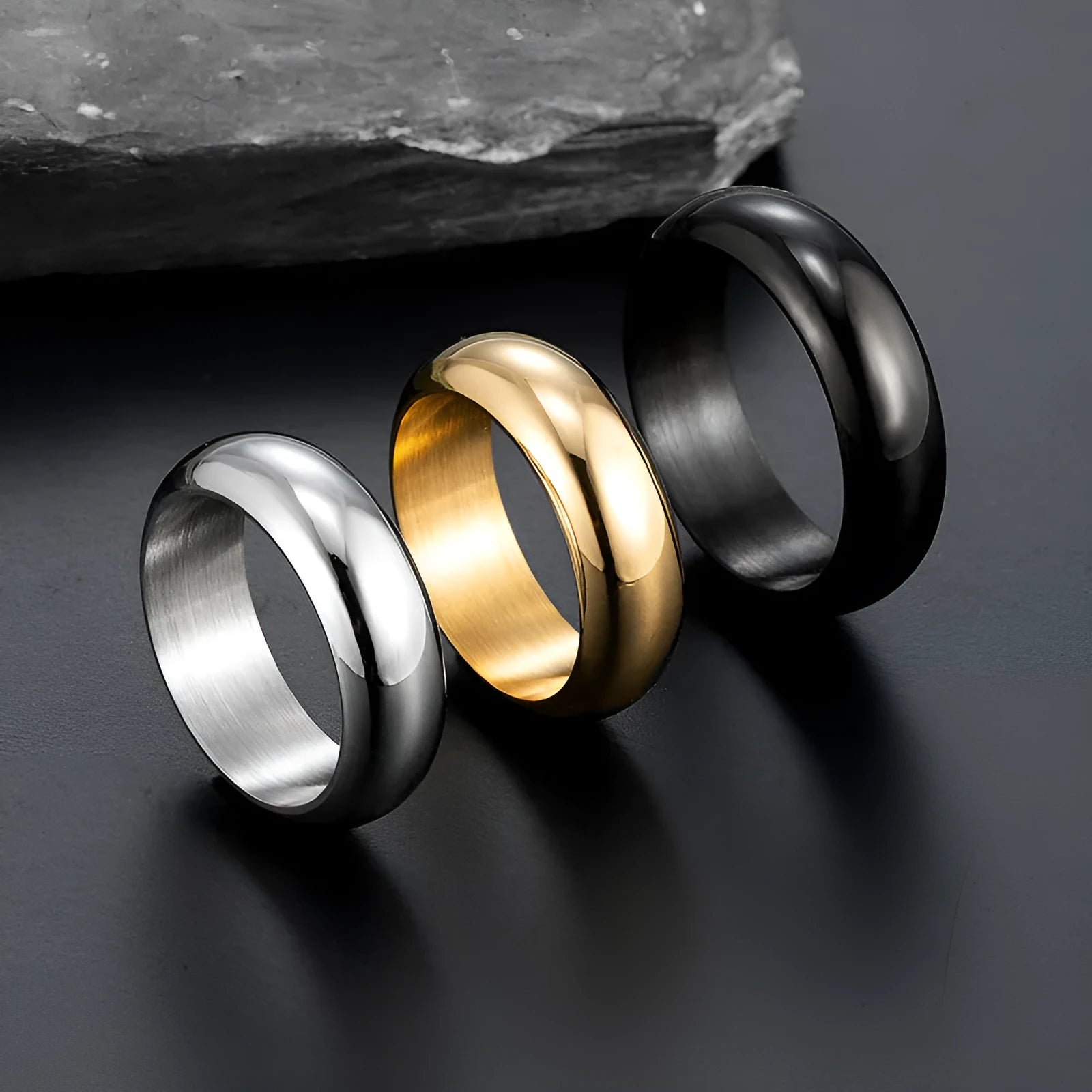 Glossy electroplated titanium steel ring shown in gold, black, and steel colour options.