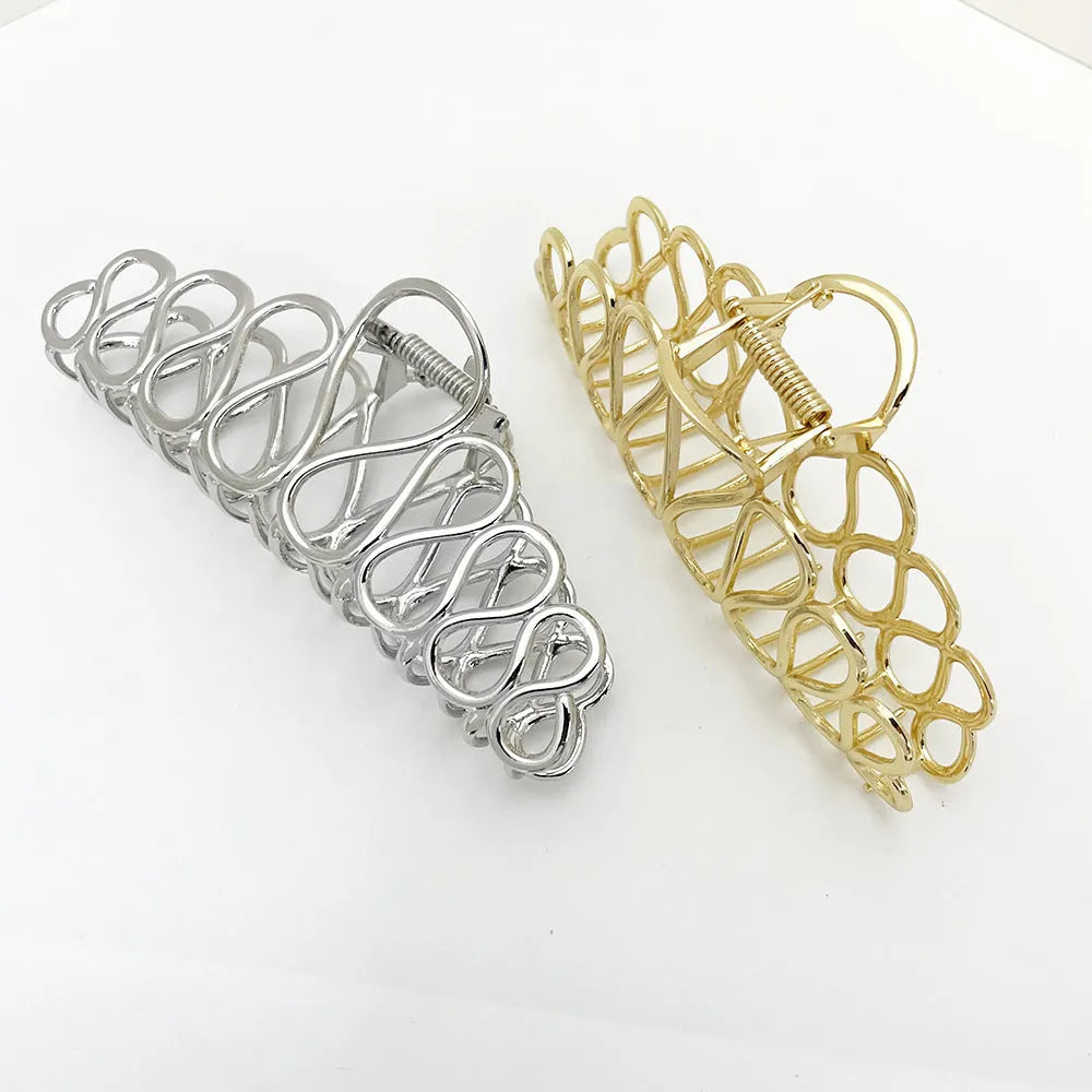 Large minimalist alloy hair clip with tassel detailing in gold or silver finish for women's updos