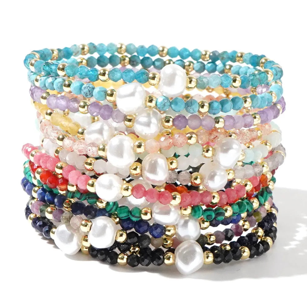 A natural stone bracelet with a geometric ellipse shape on a wrist.