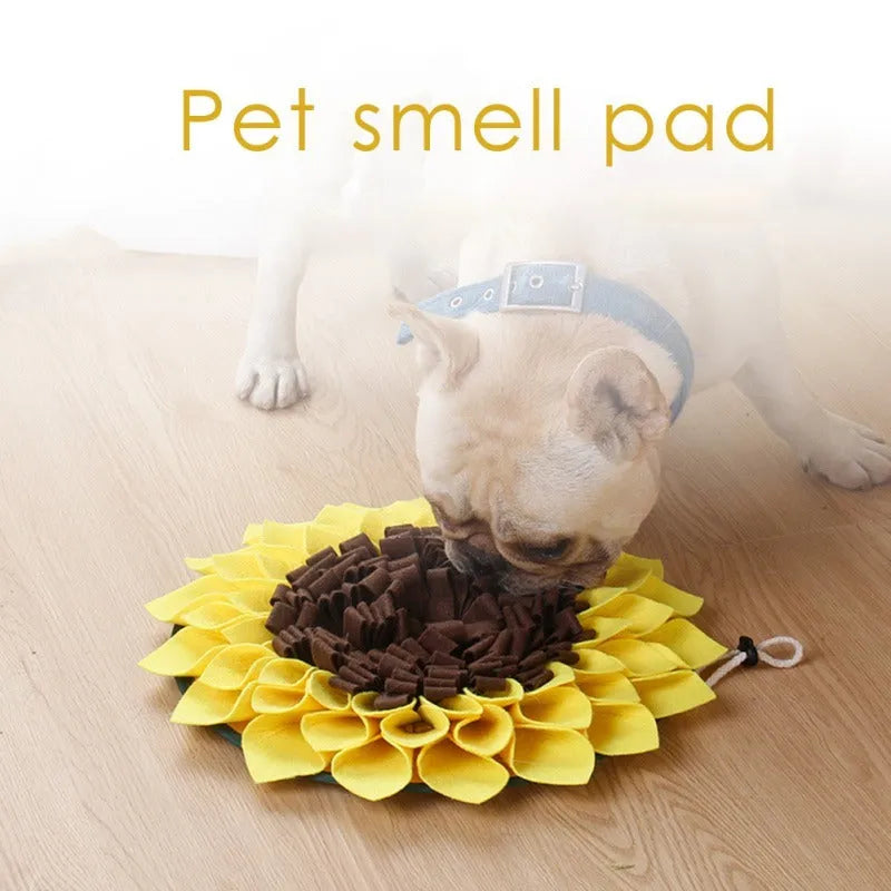 Yellow sunflower-shaped dog snuffle mat with rope attachment for nosework training