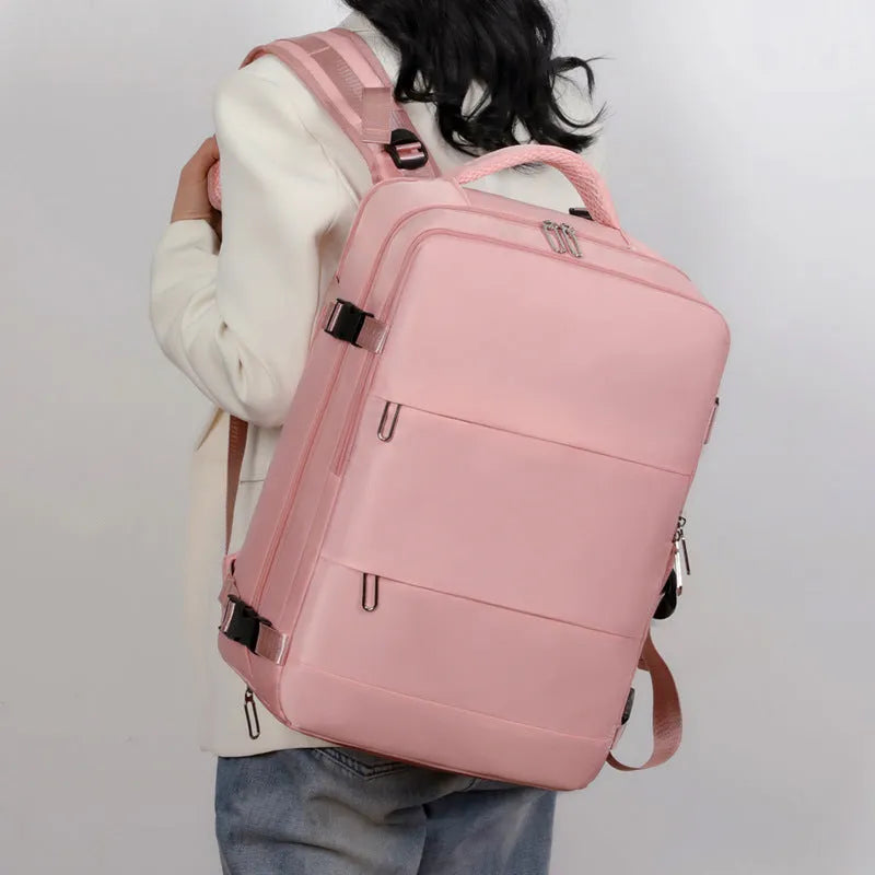 Purple waterproof travel backpack with multiple compartments showing 36-55L capacity