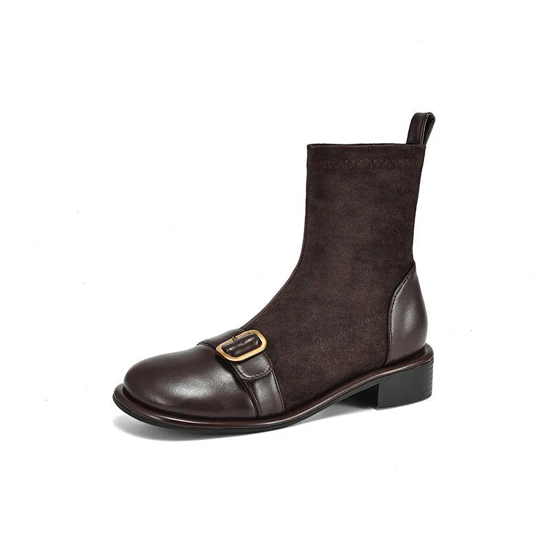 Women's black low heel Martin-style ankle boots with belt buckle stitching and front lace-up fastening.