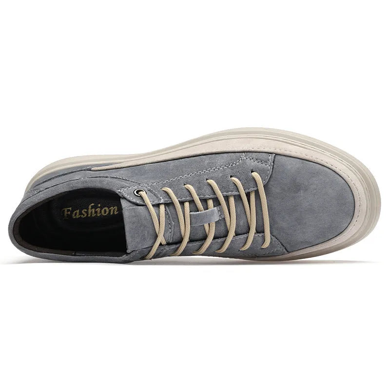 Men's grey casual skate shoes with pigskin upper and rubber sole on white background