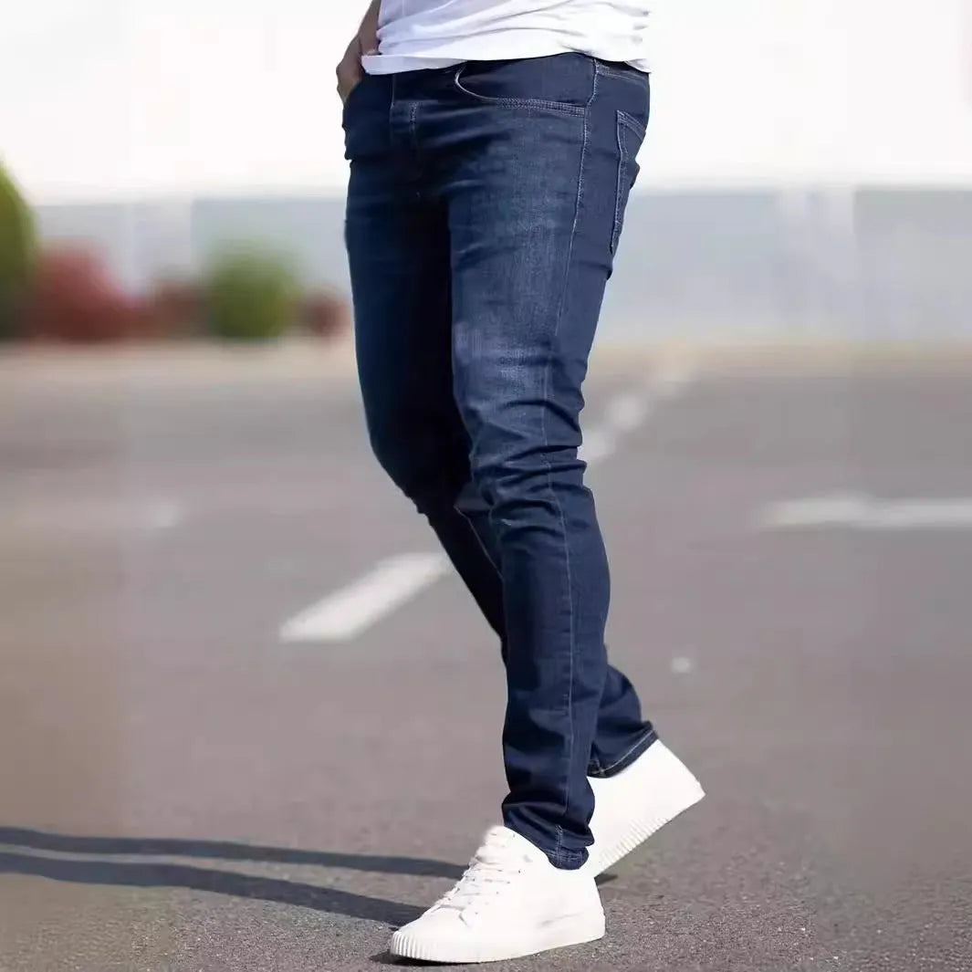 Men's dark blue slim fit cotton jeans with skinny leg opening and mid waist