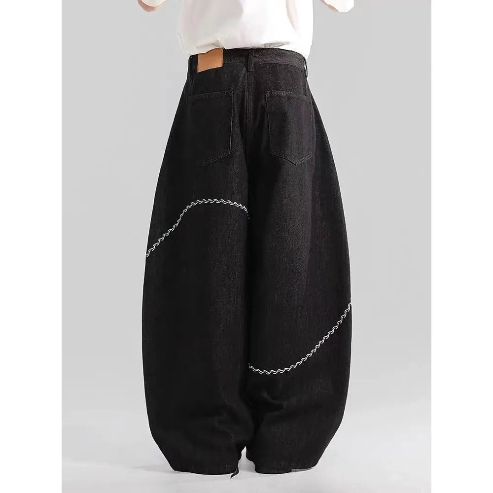 Men's black straight-leg jeans with a mid-waist design and zip fly, made from micro-elastic polyester denim.