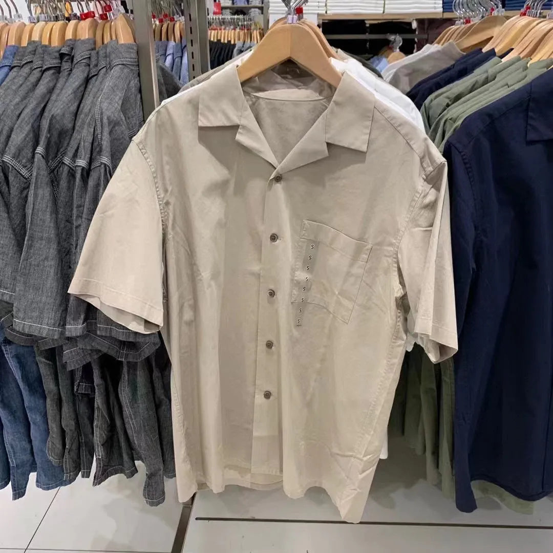 Man wearing a beige open collar modal cotton blend casual shirt with regular sleeves.