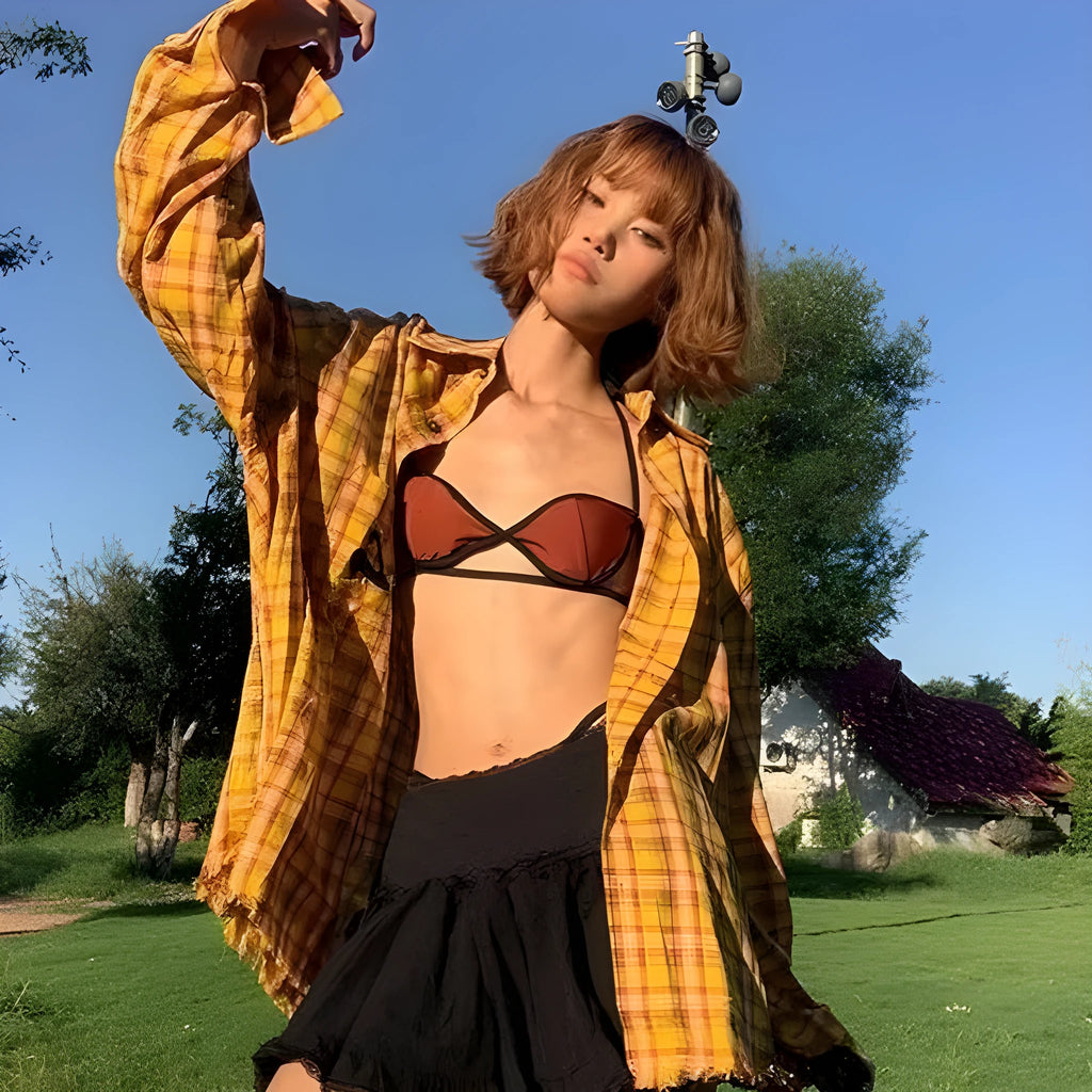 Dopamine yellow and black plaid shirt with a loose fit, shown on a hanger