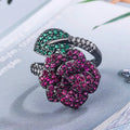 Black gold geometric flower personality ring with red corundum simulation stone on female hand