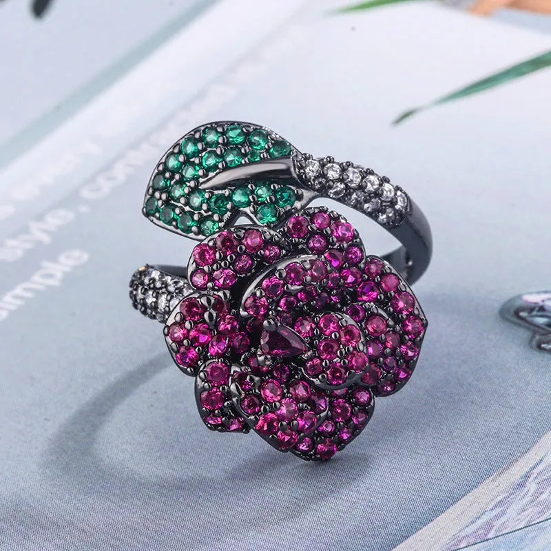 Black gold geometric flower personality ring with red corundum simulation stone on female hand