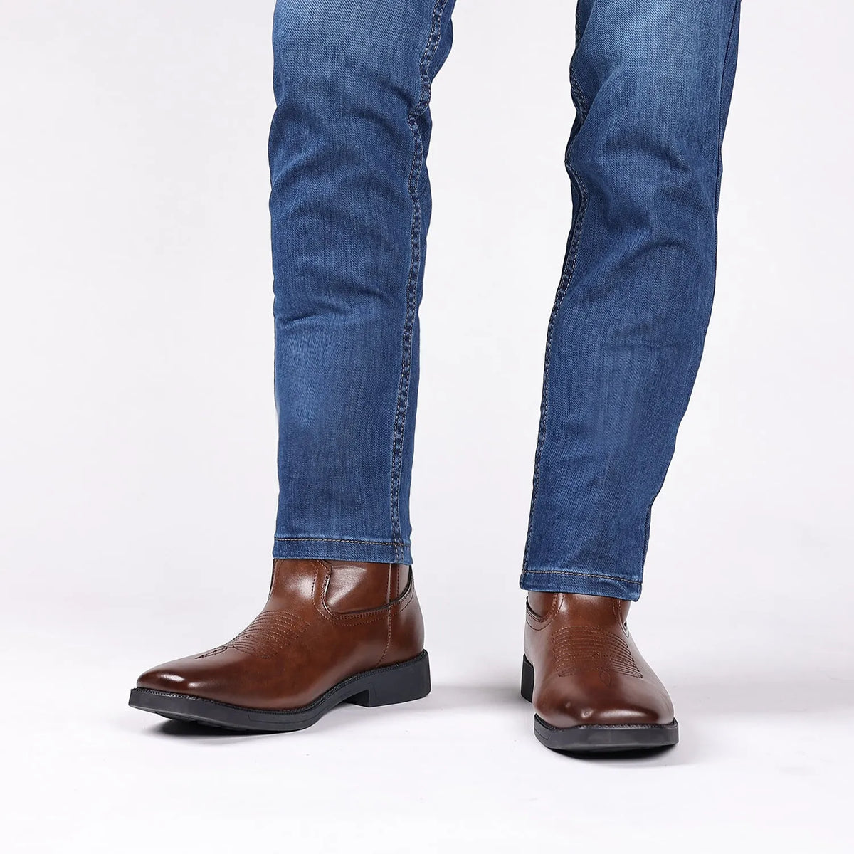 Brown retro cowboy boot for men with embroidery on the artificial leather upper and a square toe.