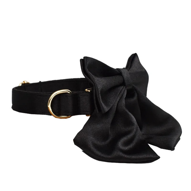 Cloth dog collar, leash, harness vest, and decorative bow set shown together in packaging.