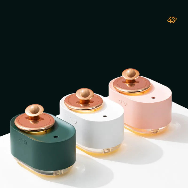 Green rotating planet-shaped USB humidifier with night light on a table