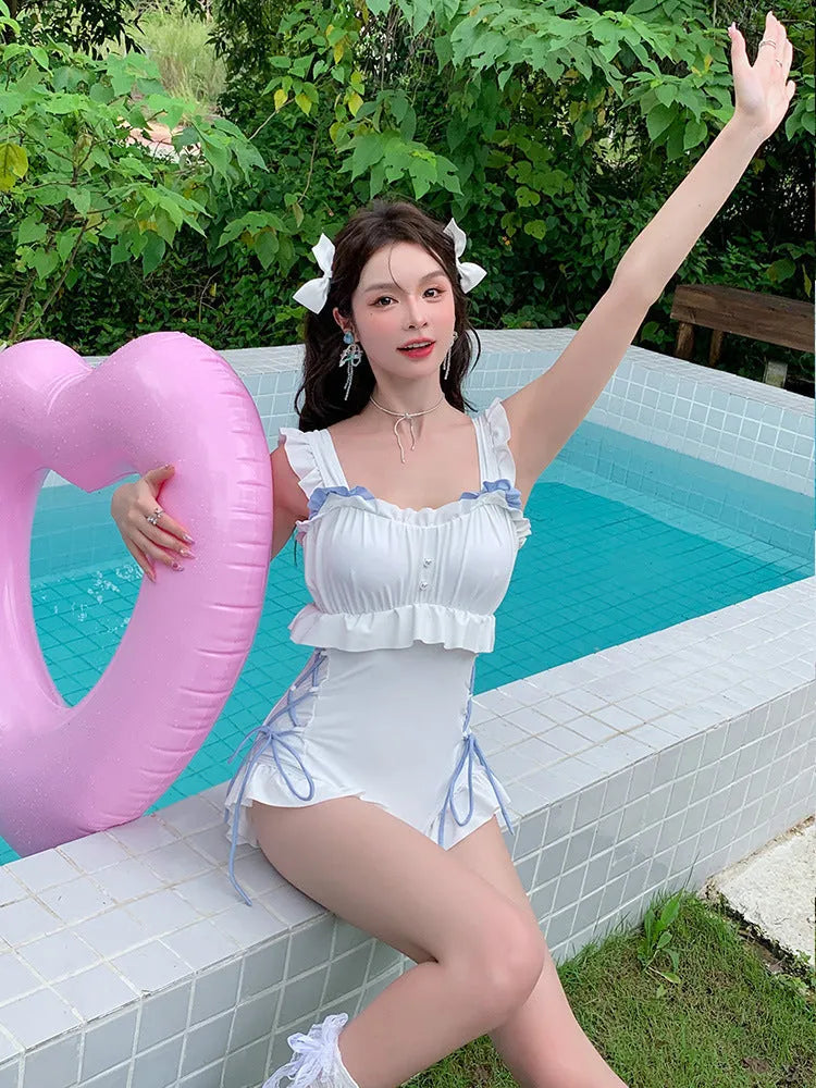 Milky White backless one-piece women's swimsuit made from nylon on a mannequin