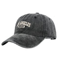 Personalised washed distressed embroidered peaked cap in acrylic fabric on adjustable head model.