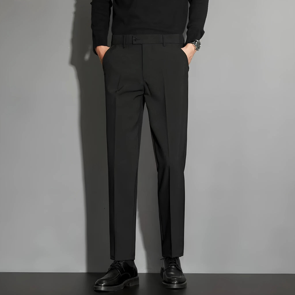 Men's straight leg suit trousers in chemical fibre blend fabric showing spring draping effect