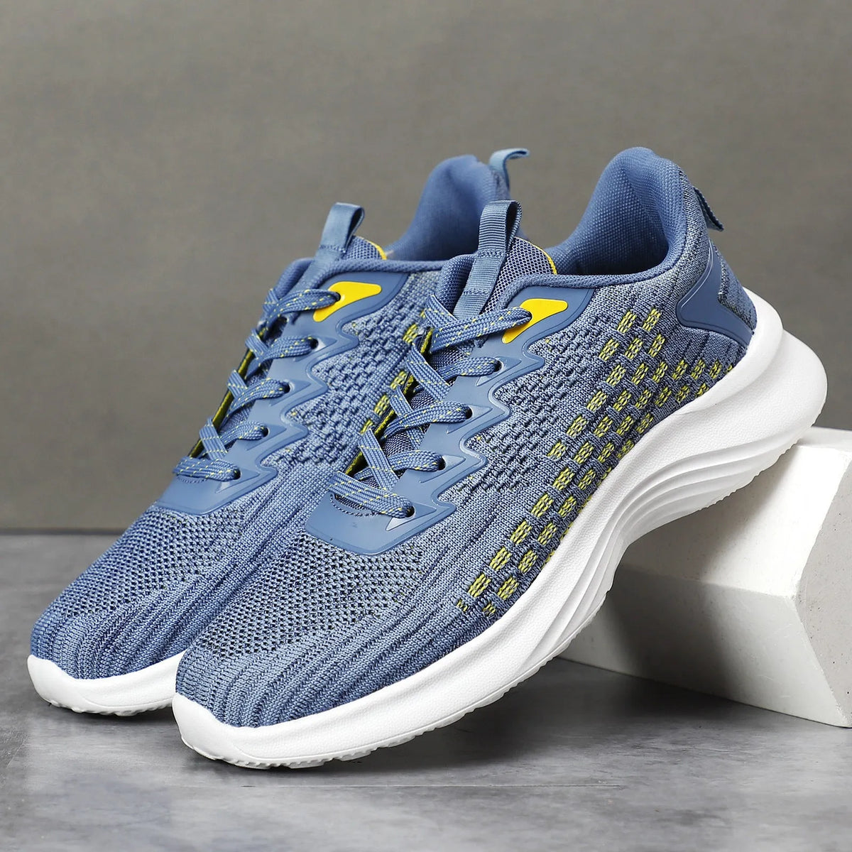 Women's Flyknit running shoes with striped pattern, mesh lining, and wedge heel in Lavender Purple or Royal Blue