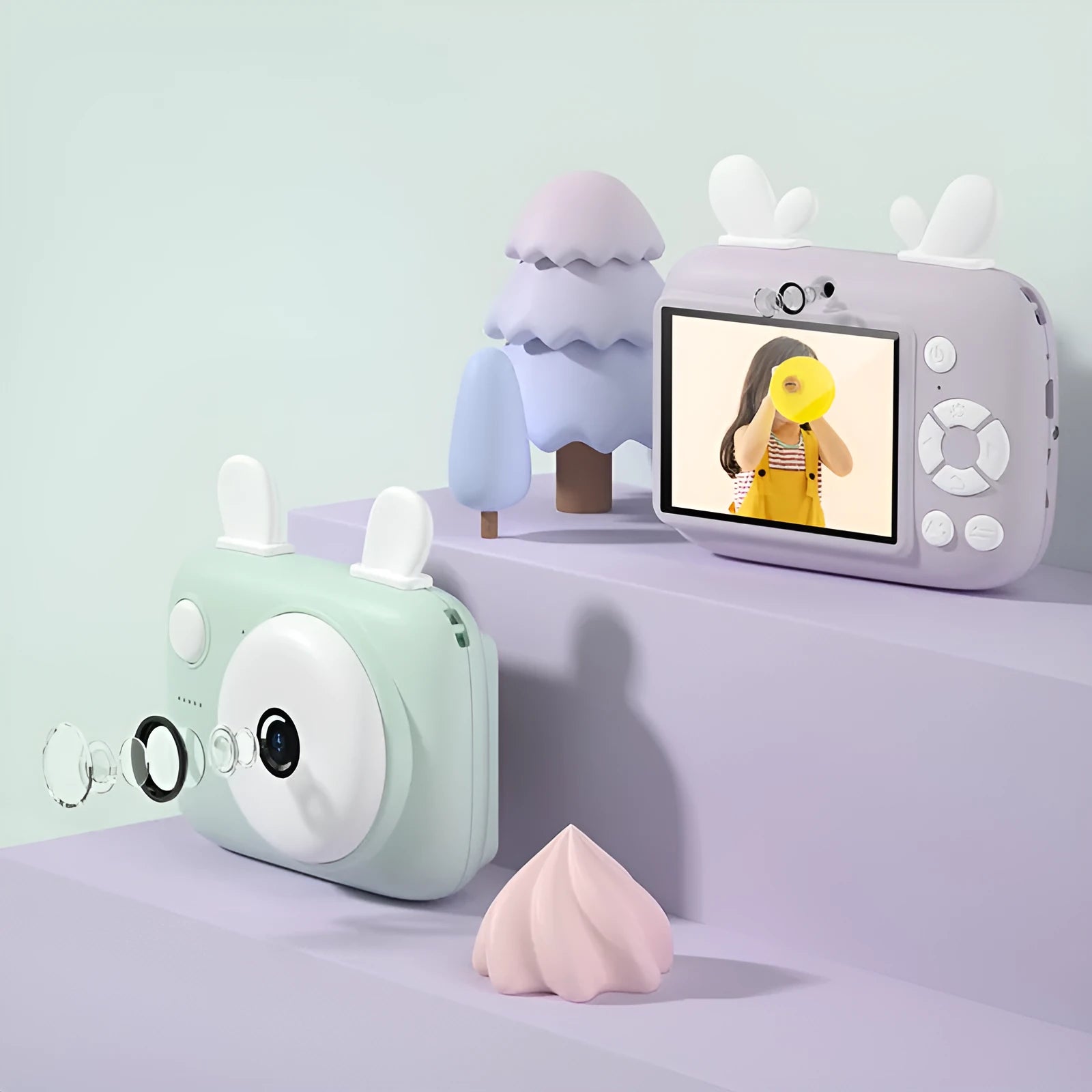 A2 Macaron-style kids digital camera in green, showing its dual lenses and 2.4-inch screen.