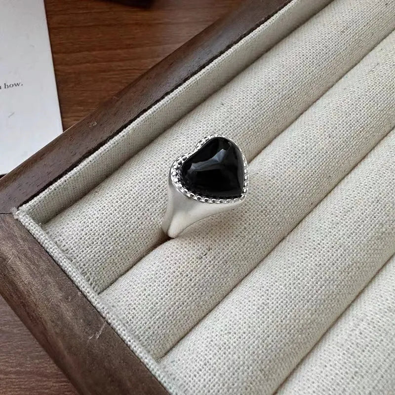 Adjustable heart-shaped sterling silver ring with black agate stone centrepiece