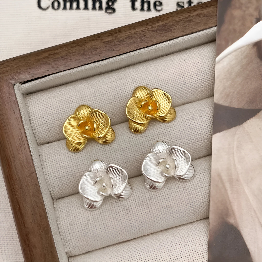 Women's retro floral copper earrings with electroplated gold or silver finish showing petal flower design