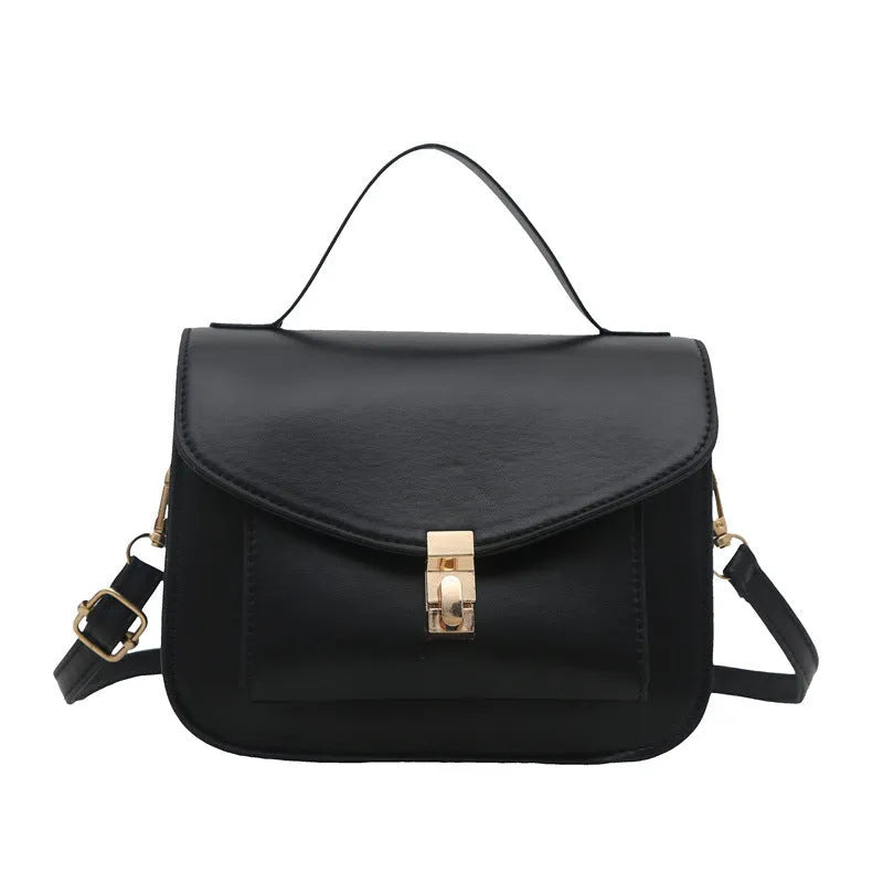 Shoulder messenger bag in horizontal square shape with sewing line detailing and crossbody strap