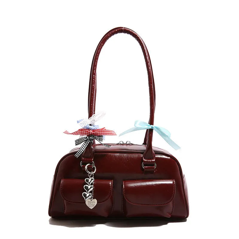 Women's black PU leather retro pillow handbag with flap closure and double shoulder straps.