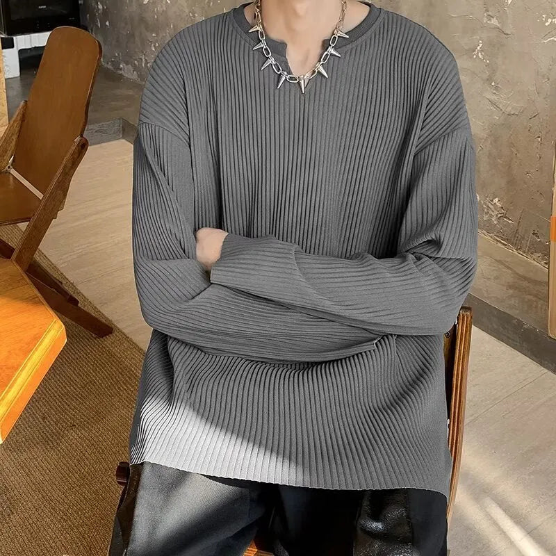 Plus size women's loose grey striped texture long sleeve pullover top on a hanger.