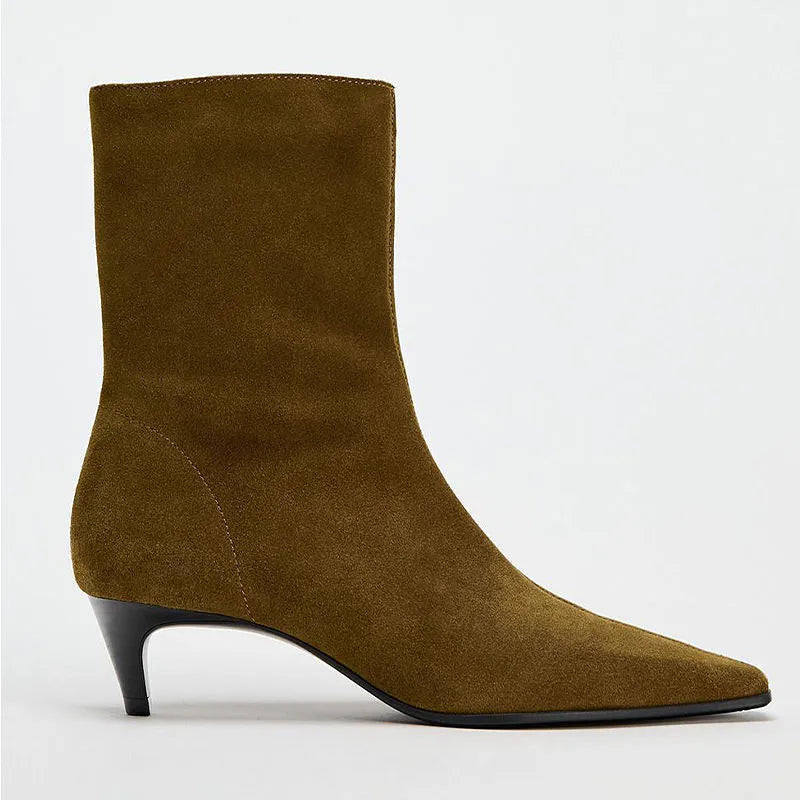 Brown square toe ankle boots with a side zip and a low kitten heel on a waterproof platform.