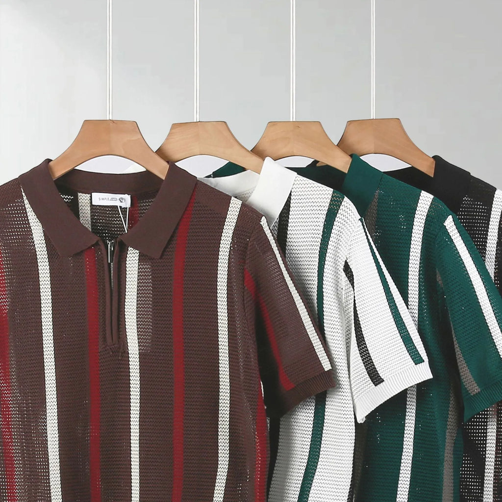Man modelling a loose fit black knitted polo shirt with a zipper decoration and short sleeves.