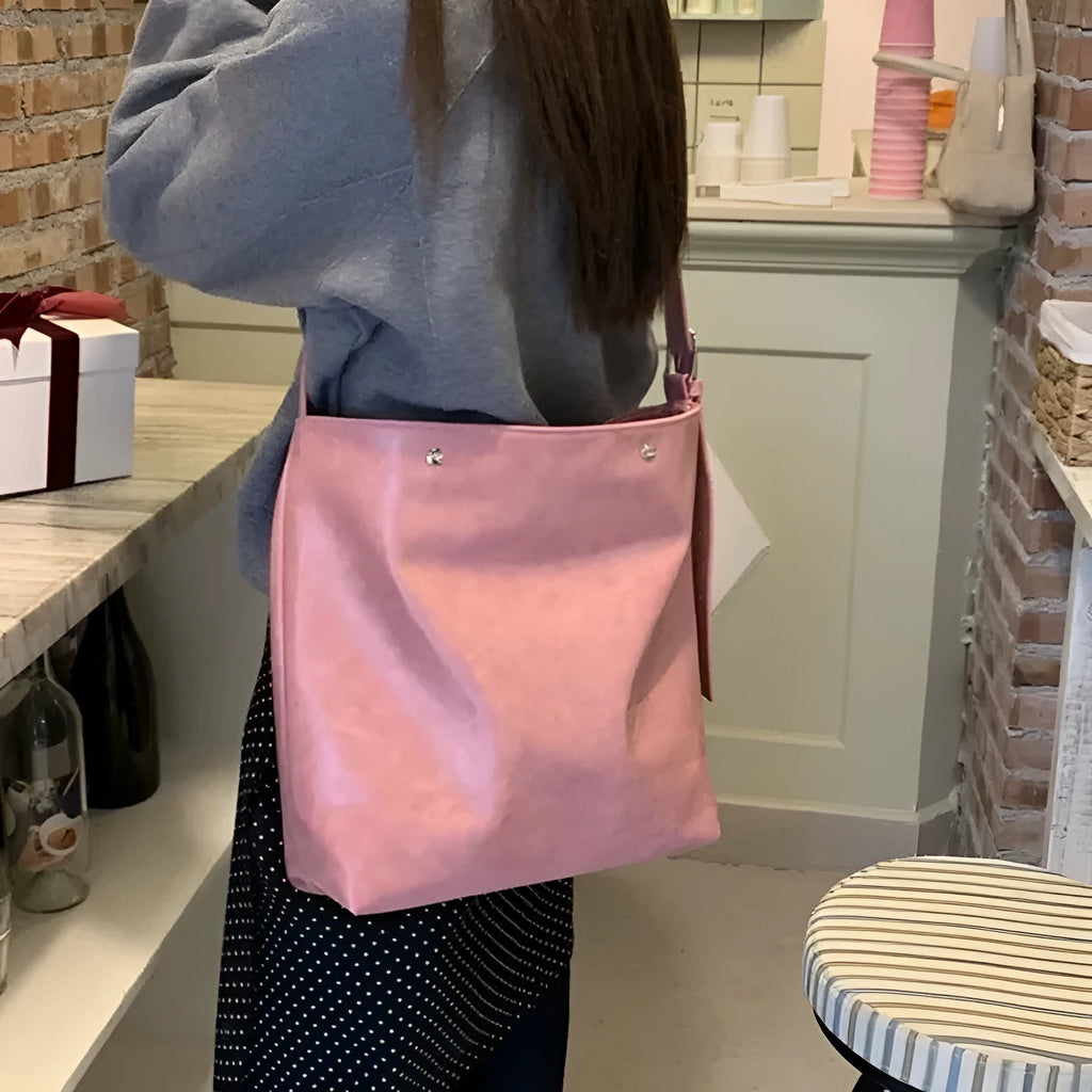 Corduroy one shoulder bag in pink or brown showing 39cm length and spacious interior for commuters