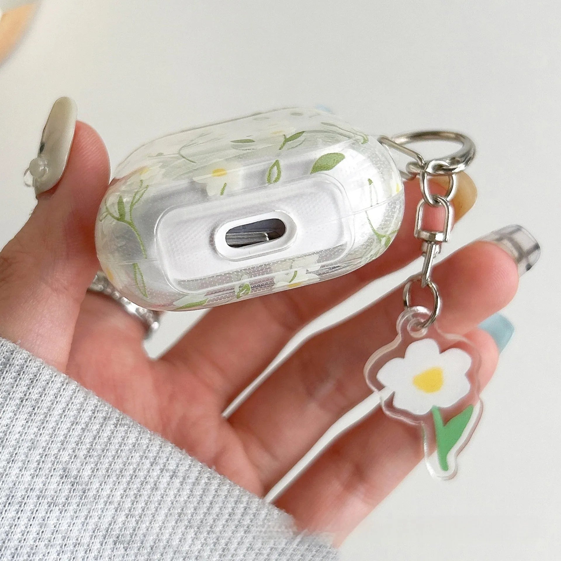 White floral pattern on a transparent TPU protective case for Apple AirPods