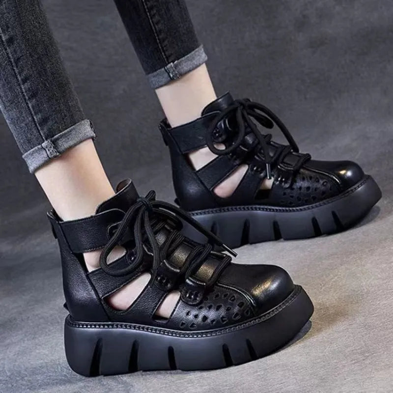 Women's black platform sandals with a hollow-hole leather upper and fish-mouth toe.