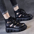 Women's black platform sandals with a hollow-hole leather upper and fish-mouth toe.