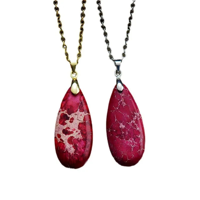 Emperor stone jade water drop pendant necklace with 18K gold plated chain on display.