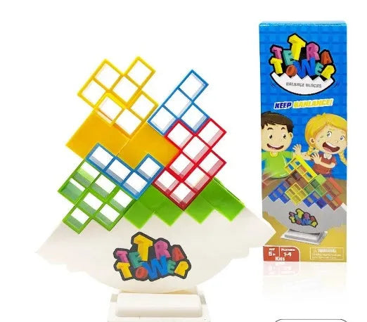 Plastic balance stacking game with 16 coloured blocks, chassis, and base on a table.