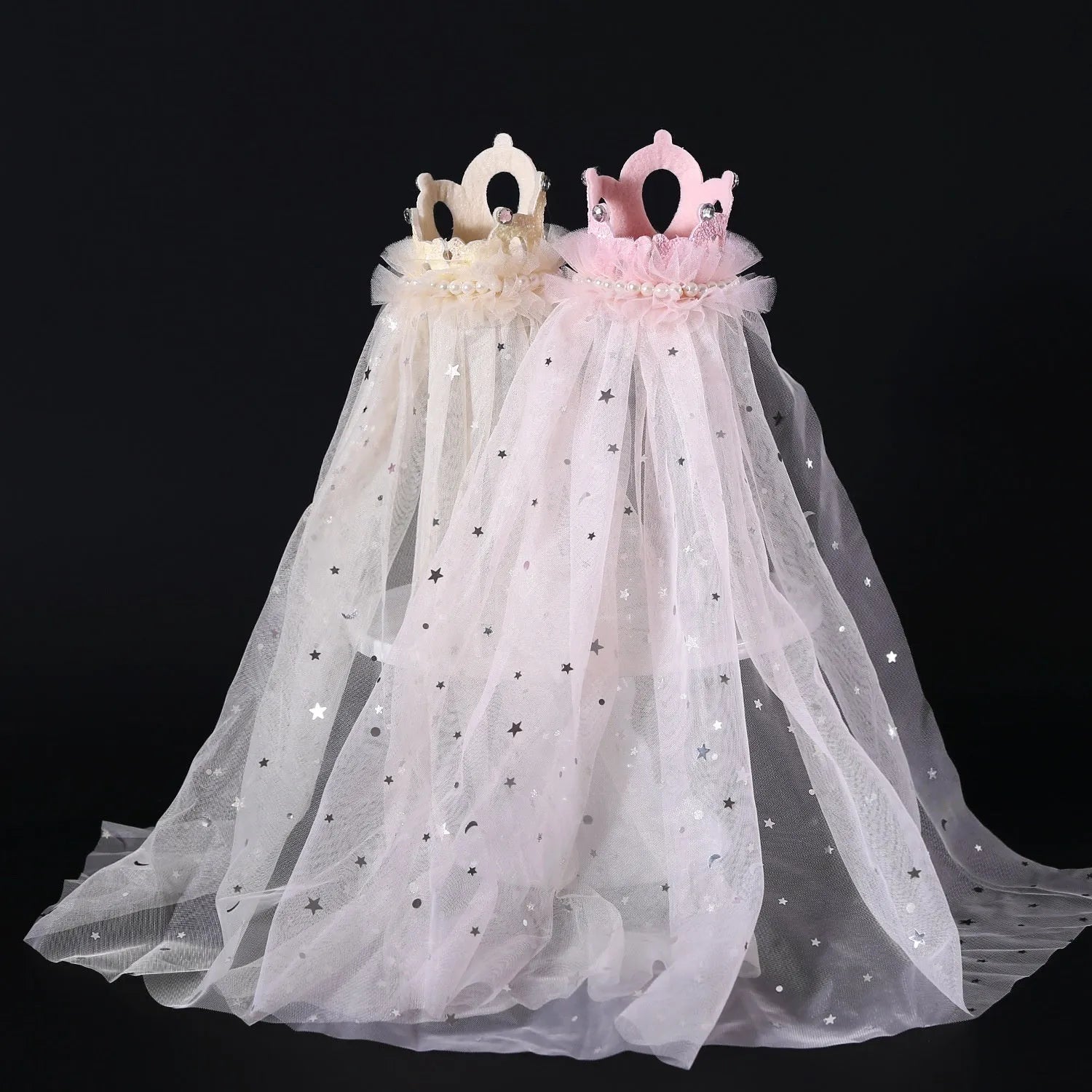 Beige and pink princess crown headdress with veil for cats on a plain background.