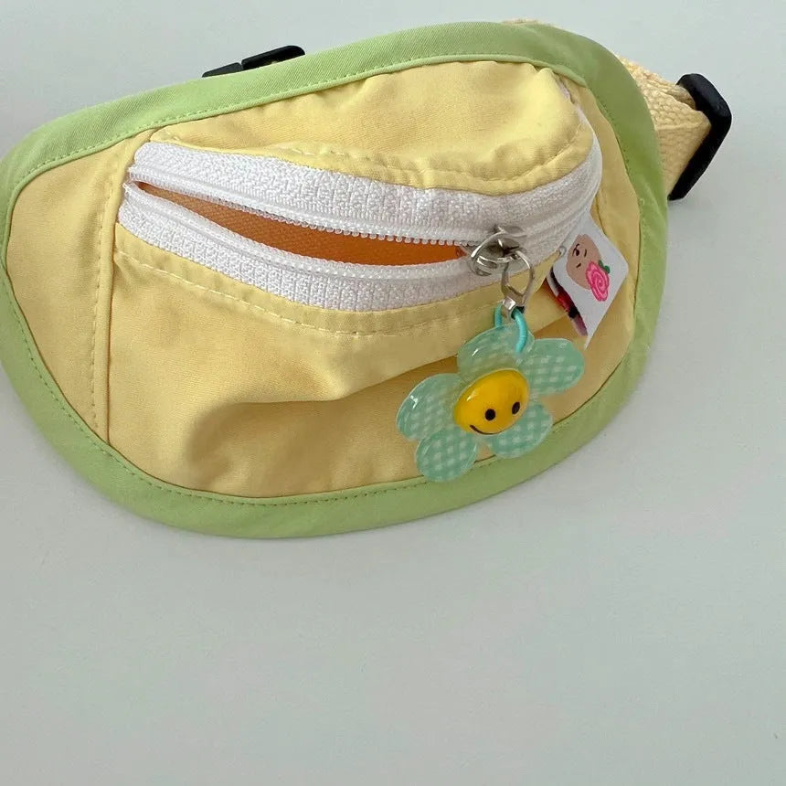 Powder blue, yellow and green backpack-style pet poop bag holder with adjustable shoulder strap