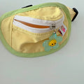Powder blue, yellow and green backpack-style pet poop bag holder with adjustable shoulder strap