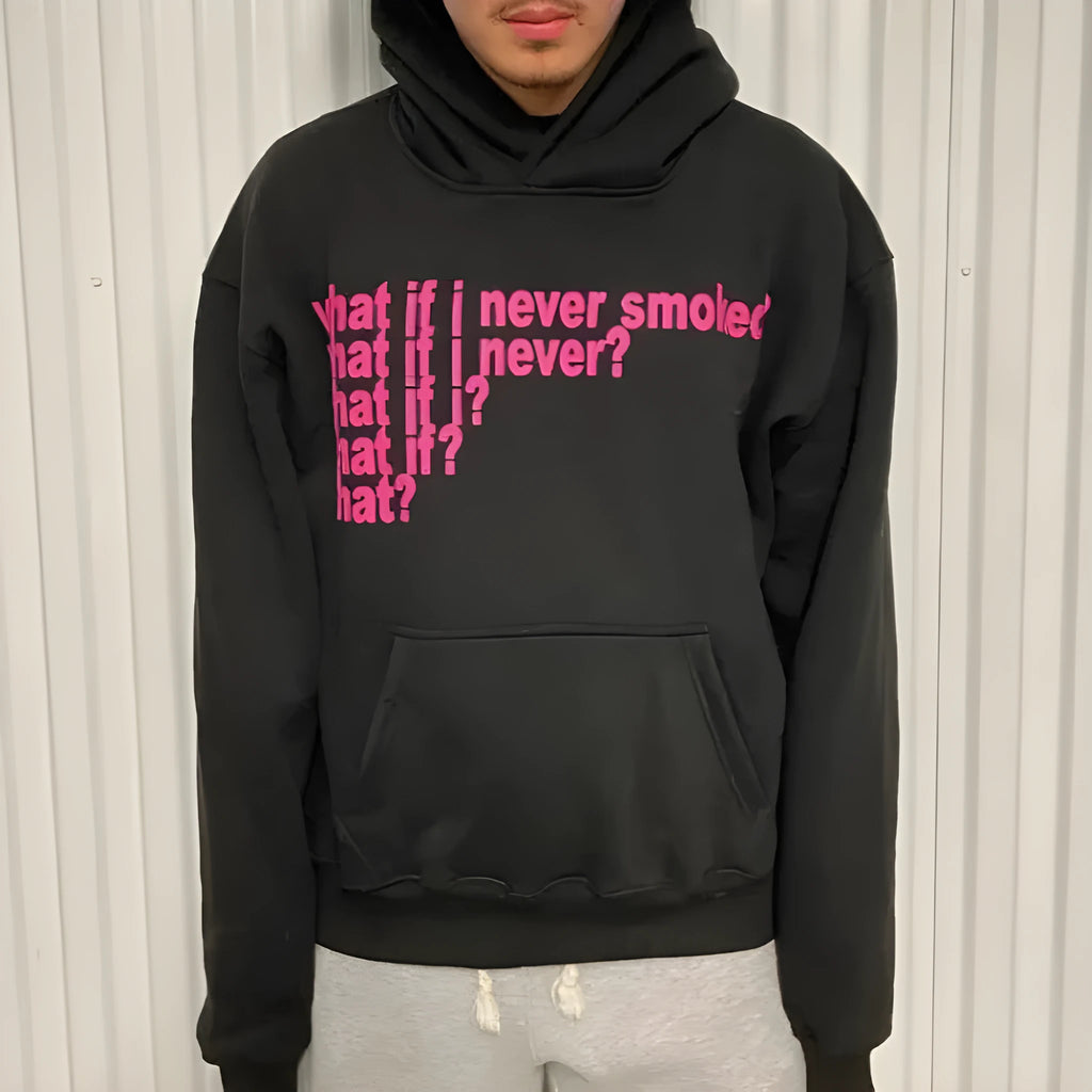 A black heavy hooded sweater with a large letter print on the front, showing a regular sleeve and hood.
