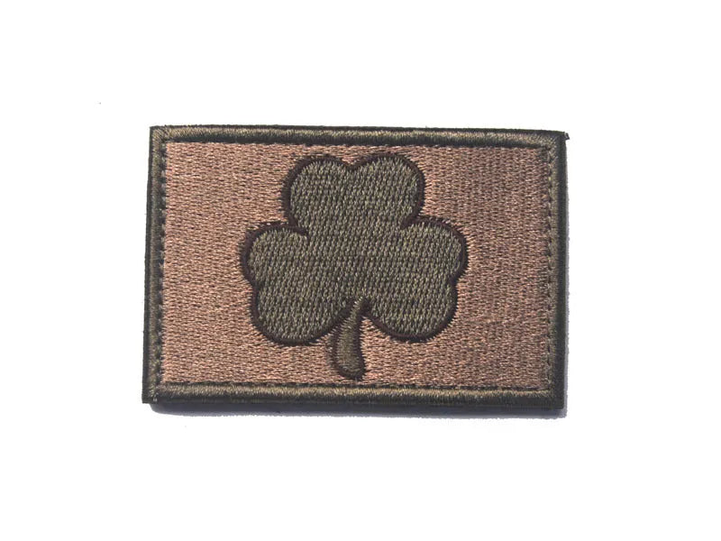 Outdoor embroidered fabric badge with Velcro strip showing clover design in green on nylon polyester material