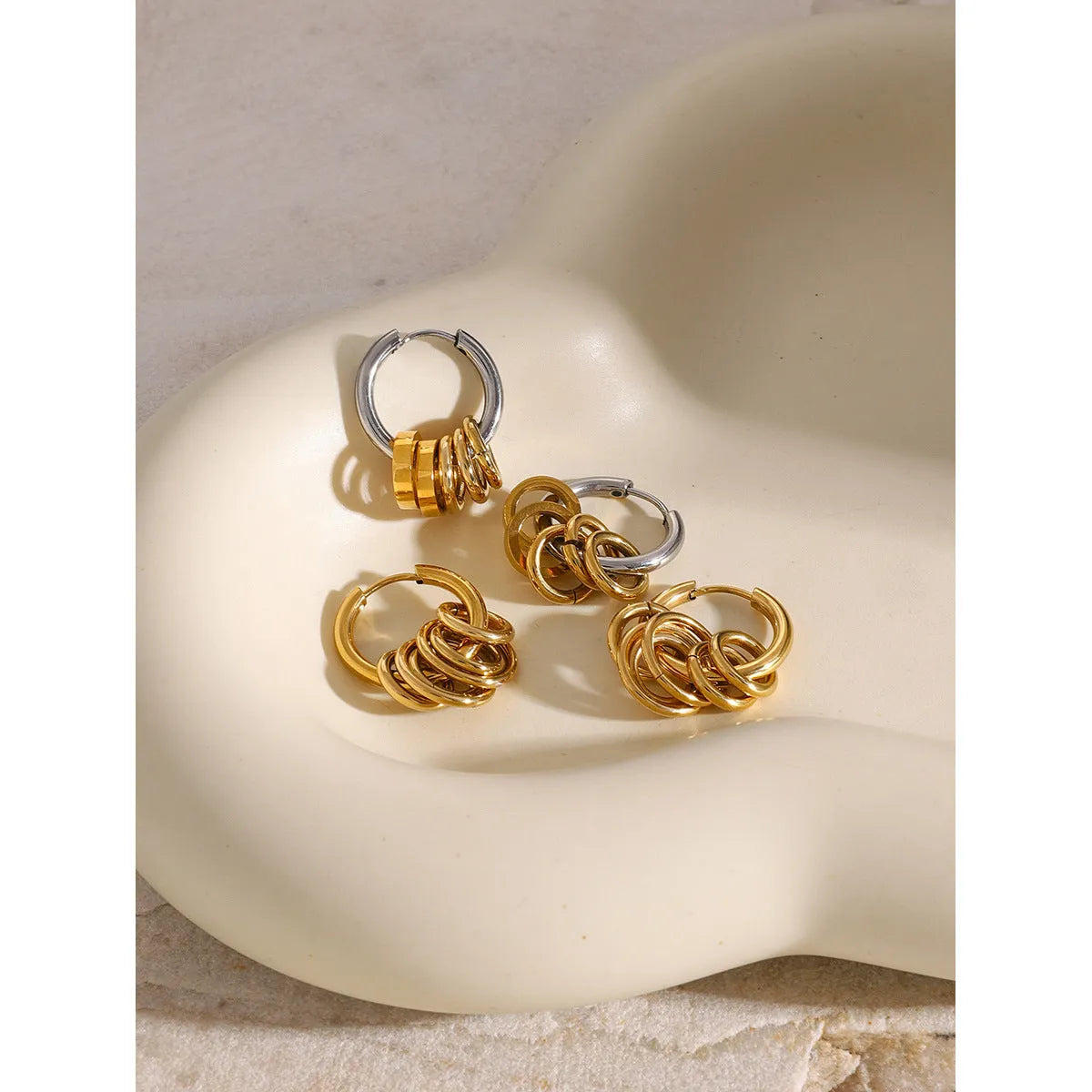 Stainless steel ins style earrings with an electroplated metallic finish.