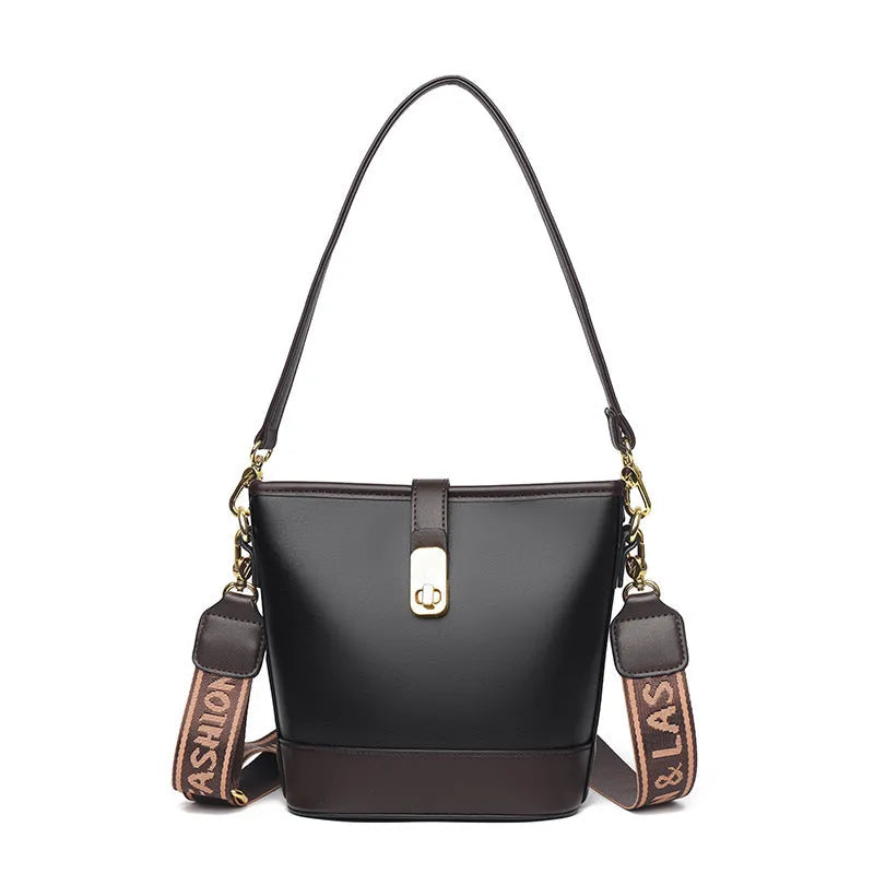 Soft black PU bucket style messenger bag with double shoulder straps, shown open to reveal internal organiser pockets.