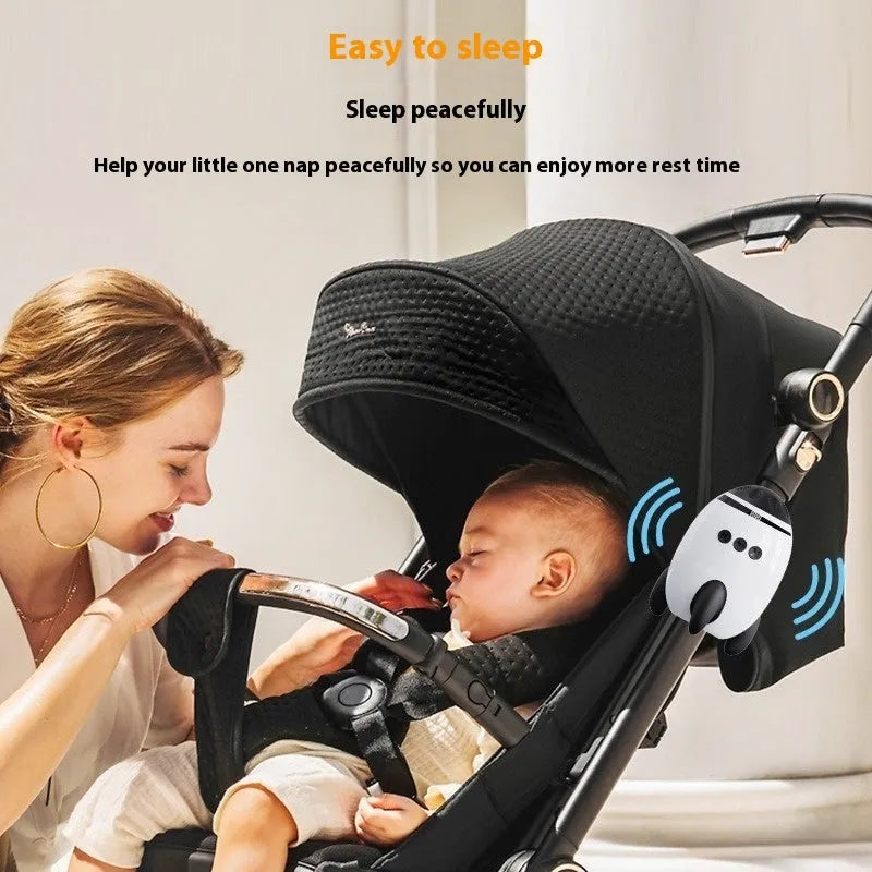White portable baby stroller shaking device with interactive toys for infant sleep and comfort.