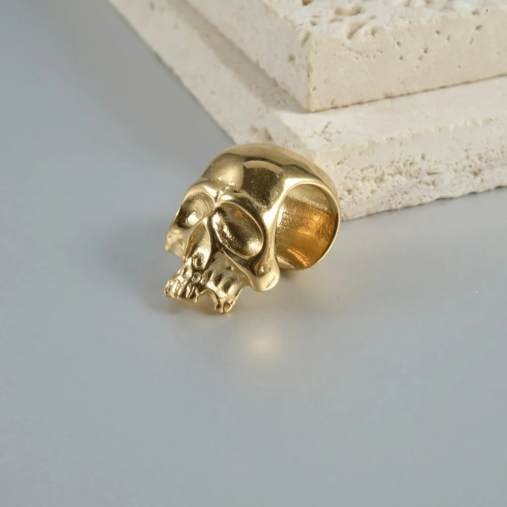 Stainless steel hollow skull Buddha earrings with geometric design in four colour options
